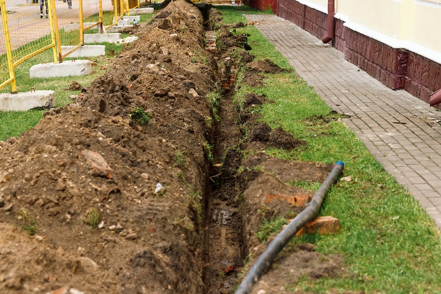A french drain pipe being laid